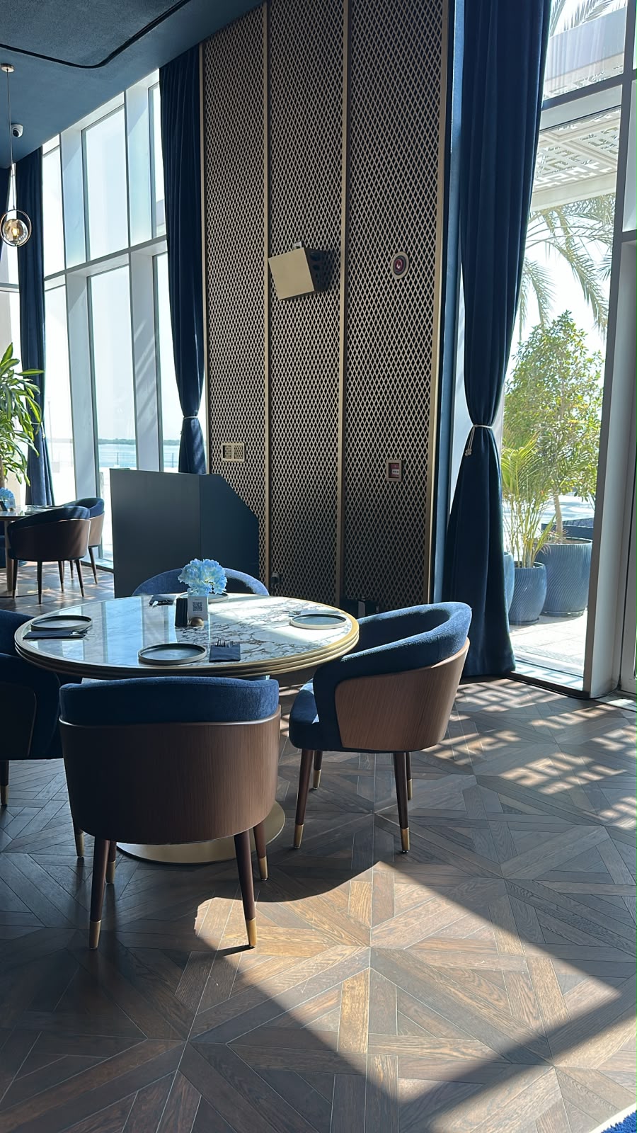 A table by the windows in the sunlit dining room