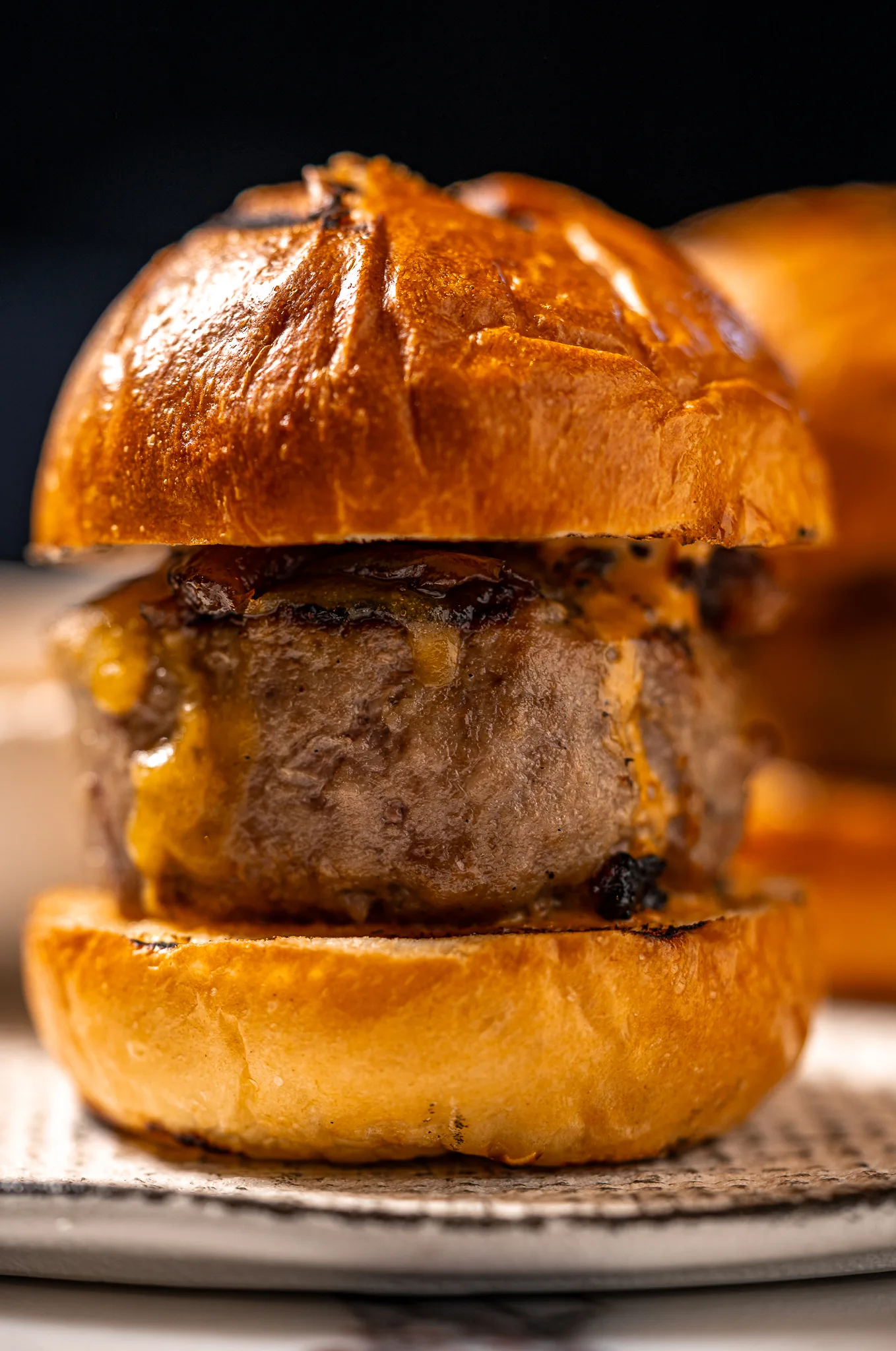 Parilla Slider - Grilled beef, caramelized onion with glaze and brioche.