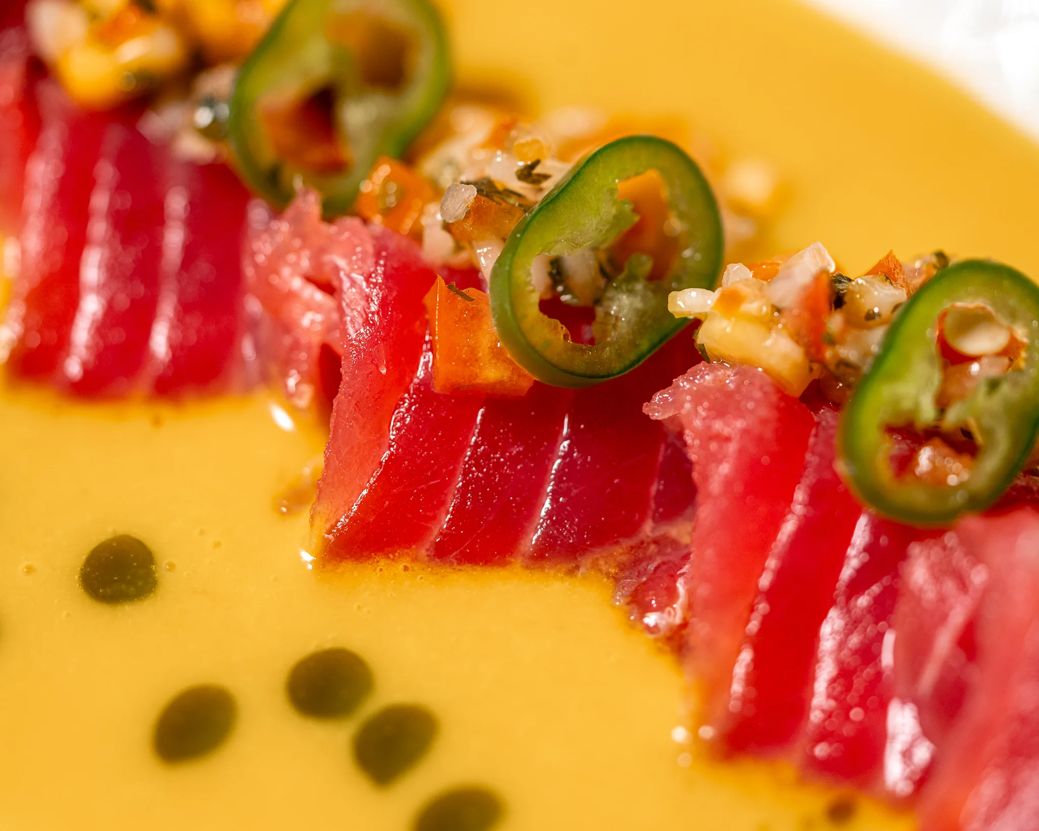 Tuna Tataki - Lightly seared akami tuna with passion fruit leche de tigre.