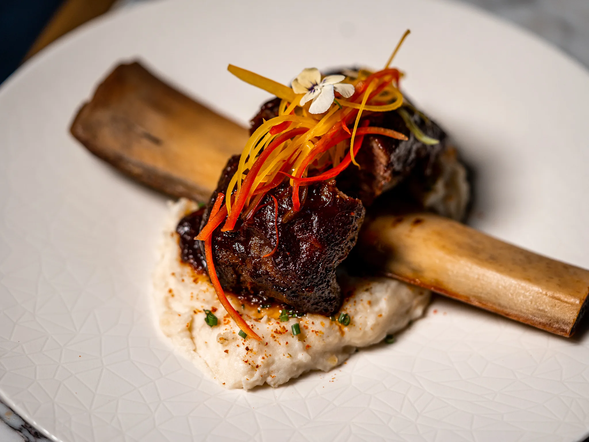 Short Rib - Slow-cooked short rib glazed in it's reduction served with mashed potato and chives.